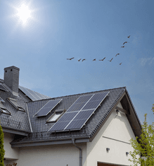 Home with rooftop solar under a sunny sky
