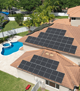 Aerial view of a home with solar panels