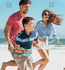 Family running together on the beach