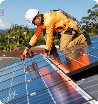 Solar installer securing panels on a rooftop